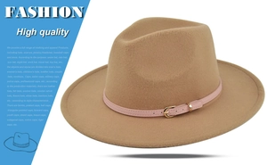 Detail view of camel fedora hat with light pink leather band and gold buckle accent