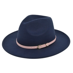 Detail view of navy blue wool fedora hat featuring a pink leather band and gold buckle
