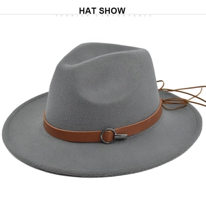 Detail view of the brown leather band and metal buckle on a gray wide brim wool felt fedora