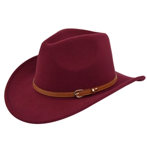 Detail of burgundy felt cowboy hat with brown leather strap and golden metal buckle