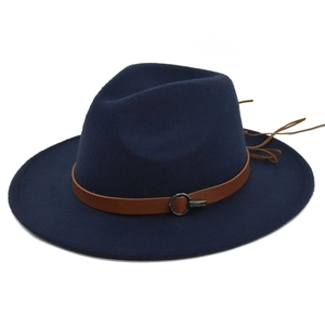 Detail view of navy wool fedora hat with brown leather belt and metallic buckle
