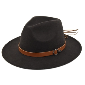 Detail shot of felt fedora hat with brown leather belt, metal buckle, and tassel accents