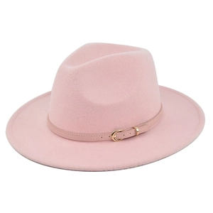 Close-up of pink wool fedora hat with matching thin leather band and metal buckle detail