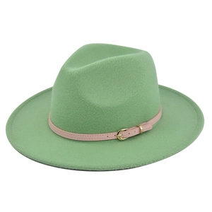 Detail of mint green fedora wool hat with pink leather belt and gold metal buckle