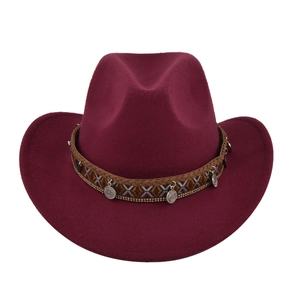Detail of burgundy wool felt cowboy hat with bohemian braided band and silver pendant