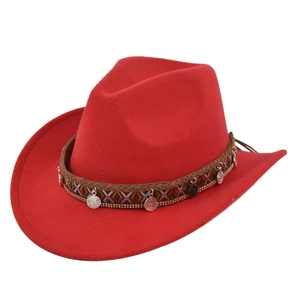 Detail of red wool felt cowboy hat with ethnic braided band and silver coin charms