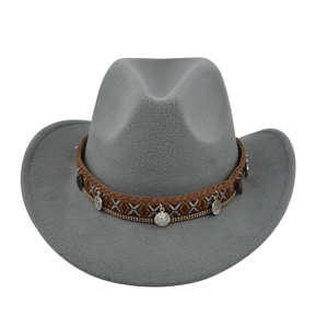 Close-up of grey felt cowboy hat featuring ethnic woven band and silver coin pendants