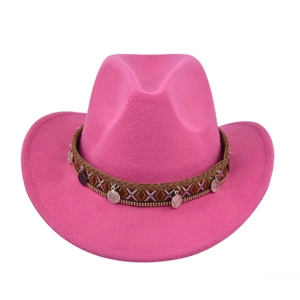Detail of hot pink felt cowboy hat featuring tribal pattern band and silver coin charms