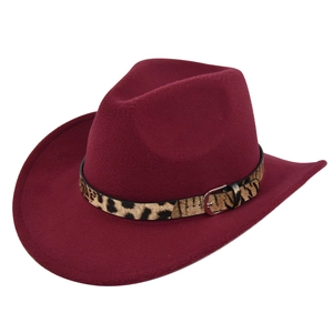 Close-up of wine red wool felt cowboy hat with leopard print band and silver metal buckle