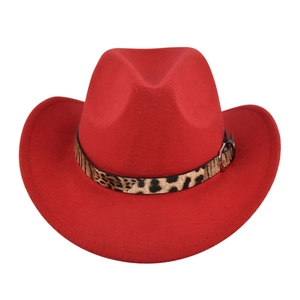 Detail of red fedora hat featuring leopard print band and silver metal buckle