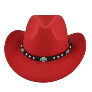 Detailed view of red felt cowboy hat with turquoise and silver studded leather band