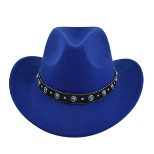 Detail of royal blue felt cowboy hat with turquoise and silver studded leather band