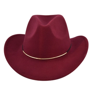 Detail of burgundy wool felt fedora with elegant gold metal curved brim decoration