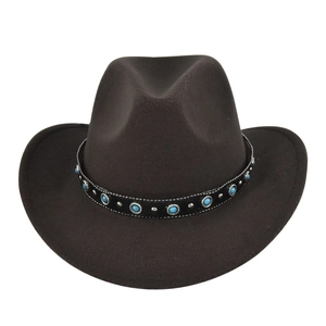 Detail of vintage cowboy hat featuring faux turquoise beads and silver rivets on band