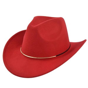 Detail of red wool felt cowboy hat featuring gold and black decorative hat band