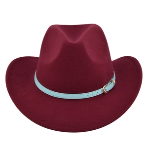 Detail of wine red felt fedora hat featuring a light blue leather band with gold buckle