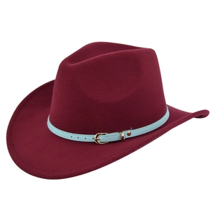 Close-up of burgundy wool felt jazz hat with light blue leather strap and gold buckle