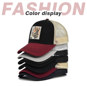 Stack of multi-color tiger embroidery trucker hats with breathable mesh and curved brim