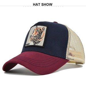 Detail of tiger patch embroidery on blue crown with breathable mesh back and red brim
