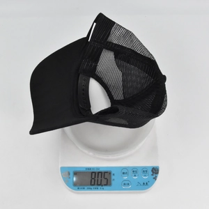 Detail view of a lightweight black tiger embroidery trucker hat weighing 80.5 grams