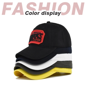 Vertical stack of baseball caps in black, navy, white, grey and yellow with embroidery