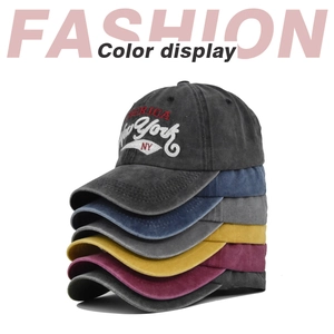 Detailed stack of six vintage washed cotton baseball caps showing various color options