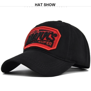 Detail showing high-quality black baseball cap with red hexagonal 3D embroidered patch