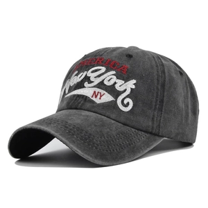 Detail of grey washed baseball cap featuring vintage New York America 3D embroidery