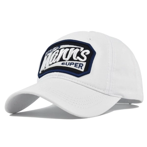 Detailed view of white cotton baseball cap with blue Kann's SUPER embroidered patch