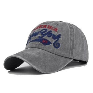 Detail of New York embroidery on dark grey washed cotton vintage baseball cap
