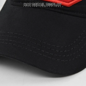Detail view of reinforced three-row stitching on high-density black twill cotton cap brim