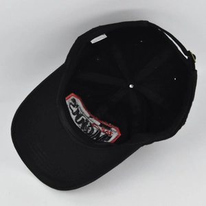 Detail view of cotton baseball cap interior featuring embroidery and adjustable strap