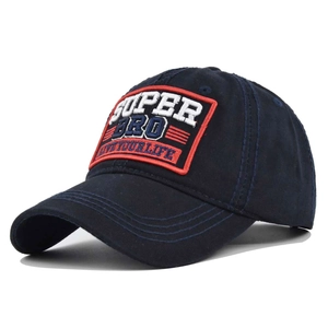 Detail of SUPER BRO embroidery on navy blue canvas cotton baseball cap with red border