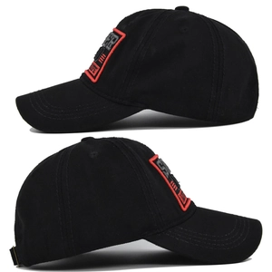 Detail view of the black baseball cap showing the side profile and high-quality red embroidery