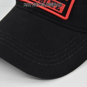 Detailed close-up of premium 3D embroidery and stitching on a black cotton baseball cap
