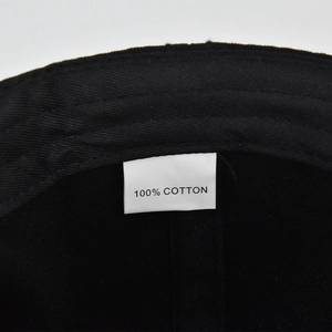 Detail of 100% cotton baseball cap interior showing fine stitching and quality fabric label