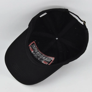 Close-up of internal 100% cotton label and 1983 embroidery on black baseball cap