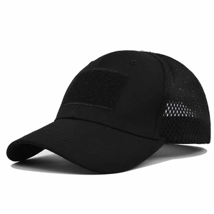 Close-up of black tactical baseball cap with breathable mesh and front velcro patch