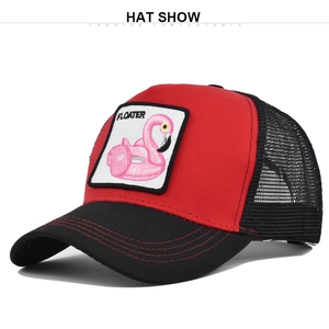 Close-up of red trucker hat featuring flamingo embroidery and black mesh back