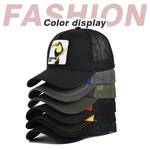 Multiple color variations of trucker hats featuring Toucan embroidered patch details