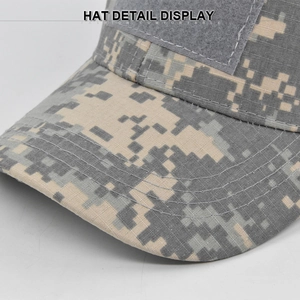 Detail view of digital camouflage tactical hat featuring hook-and-loop patch and stitching