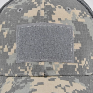 Detail of digital camo tactical hat featuring velcro patch area and ventilation eyelets