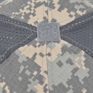 Macro view of digital camouflage tactical cap with top velcro patch and mesh fabric