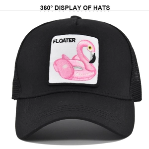 Close-up of black mesh trucker hat with pink flamingo floater embroidery and white patch