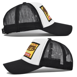 Detail of western vintage bear embroidery on a black and white mesh trucker cap