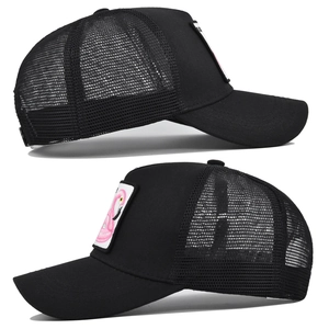 Detailed side view of black mesh trucker hat with pink flamingo embroidery and patch