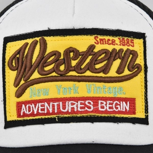 Front view of white mesh baseball cap featuring vintage 1985 Western adventure embroidery patch
