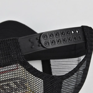 Close-up of the black snapback closure and mesh fabric on this western baseball cap
