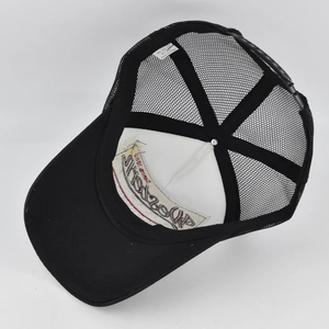 Internal structure of black trucker hat with white breathable mesh and adjustable strap