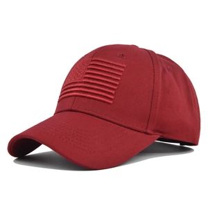 Close-up of 3D American flag embroidery on a dark red structured cotton baseball cap